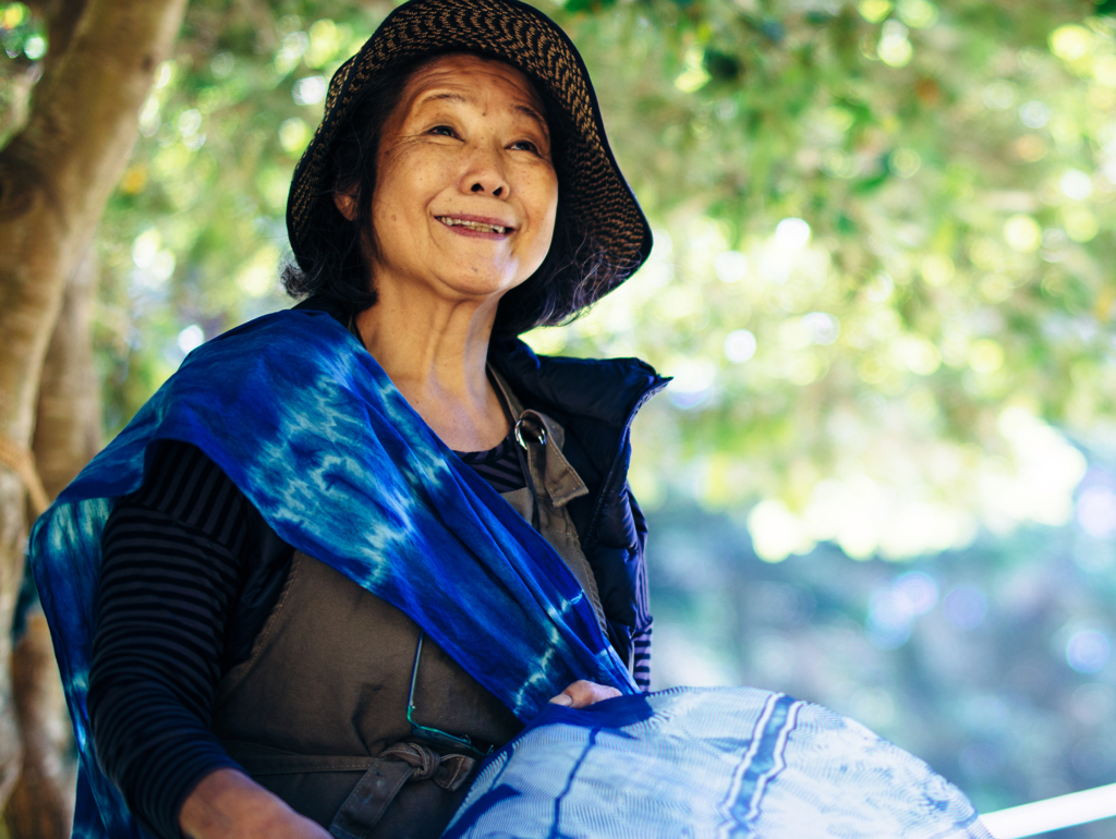 Yoshika Wada in a hat smiling